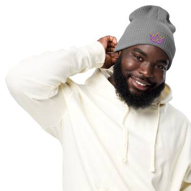 Man in light grey Royalty beanie – angled front view showing purple and gold embroidered crown
